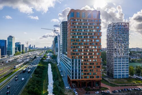 Modern urban district with high-rise buildings, green spaces, and good infrastructure.