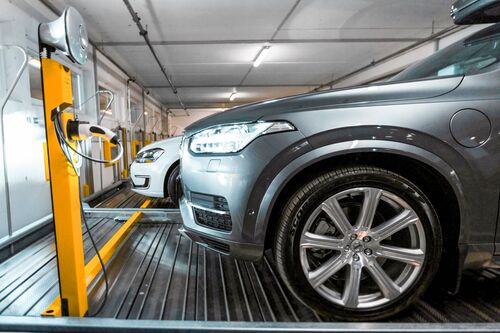 A car is parked on a parking platform in a multi-storey car park