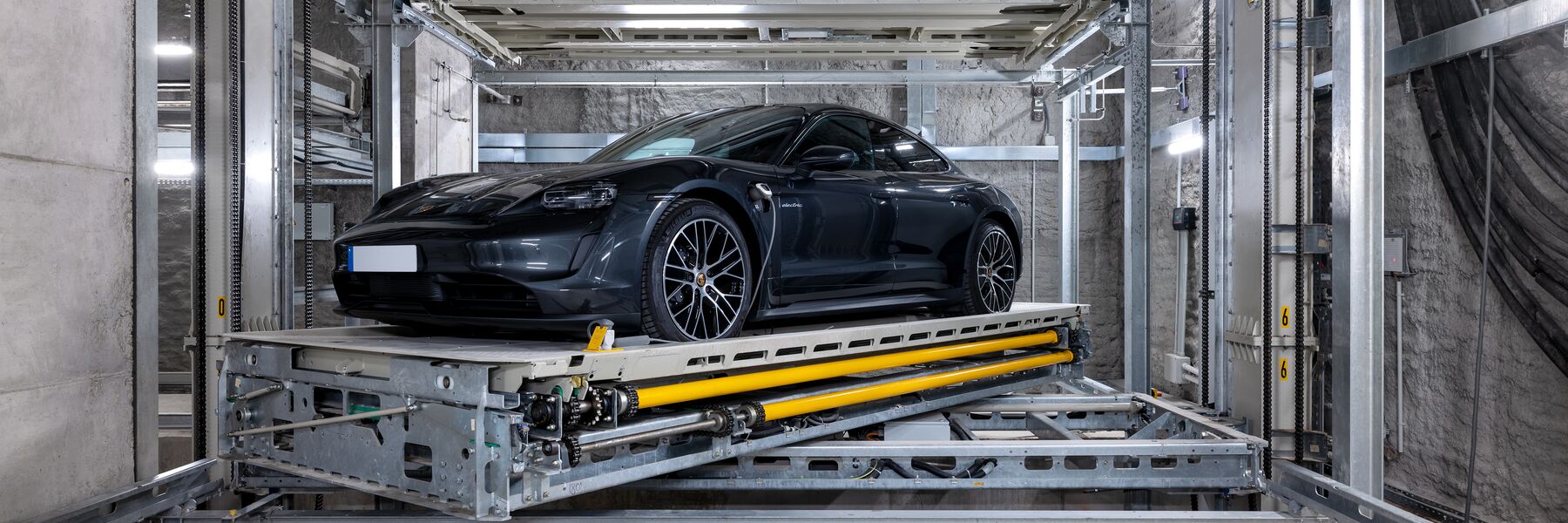 The car is parked on the platform within the parking system